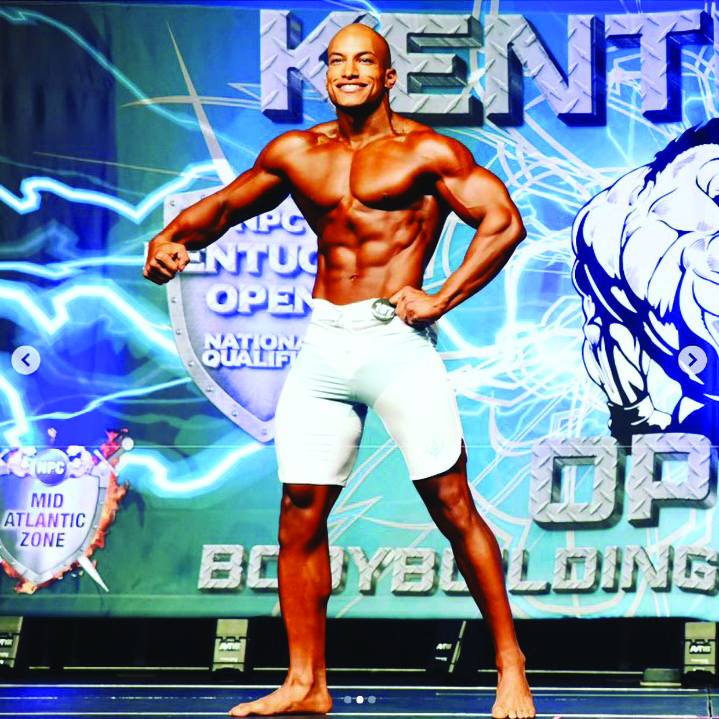 SSG Cyril Peters, paralegal and administrative law NCOIC, Office of the Staff Judge Advocate, 1st Theater Sustainment Command, competes at the National Physique Kentucky Open Amateur Body Building Competition in Lexington, KY. (Credit: Barbara Gersna)